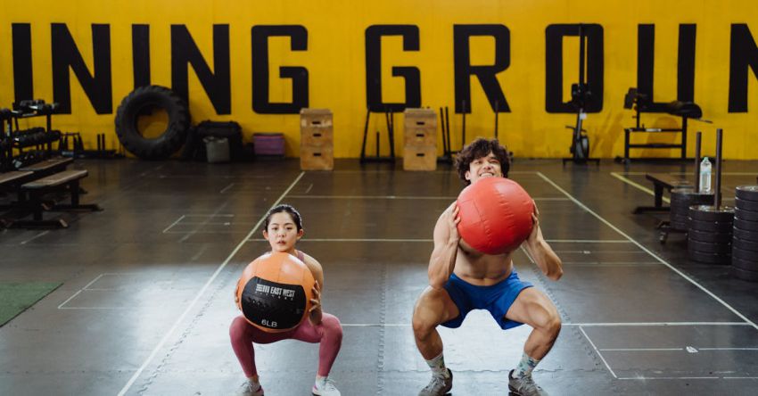 Medicine Balls - A Couple Working Out with Medicine Balls