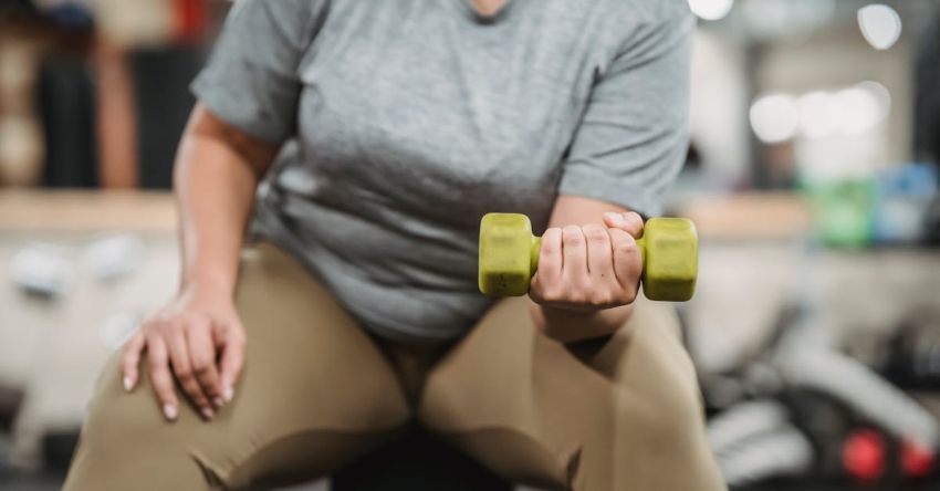 Weight Benches - Crop black woman doing exercises with dumbbells