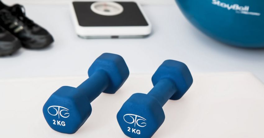 Dumbbell Brands - Two 2 Kg. Blue Hex Dumbbells on White Surface