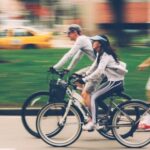 Exercise Bikes - Woman and Man Riding on Bike