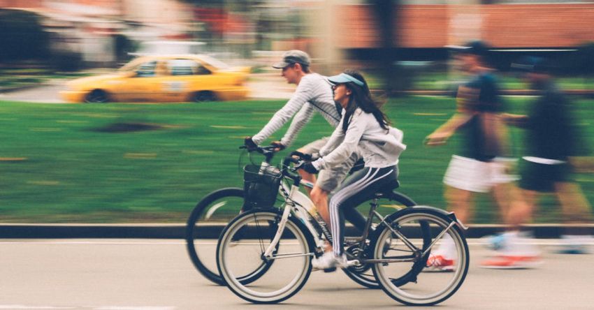 Exercise Bikes - Woman and Man Riding on Bike