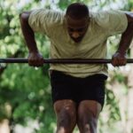 Pull-up Bar - A Man Pulling Himself over the Pull-up Bar