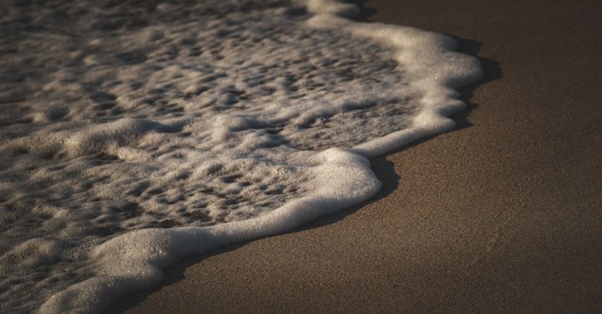 Foam Rollers - A wave is coming in on the beach