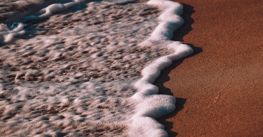 Foam Rollers - A close up of the ocean waves on a beach